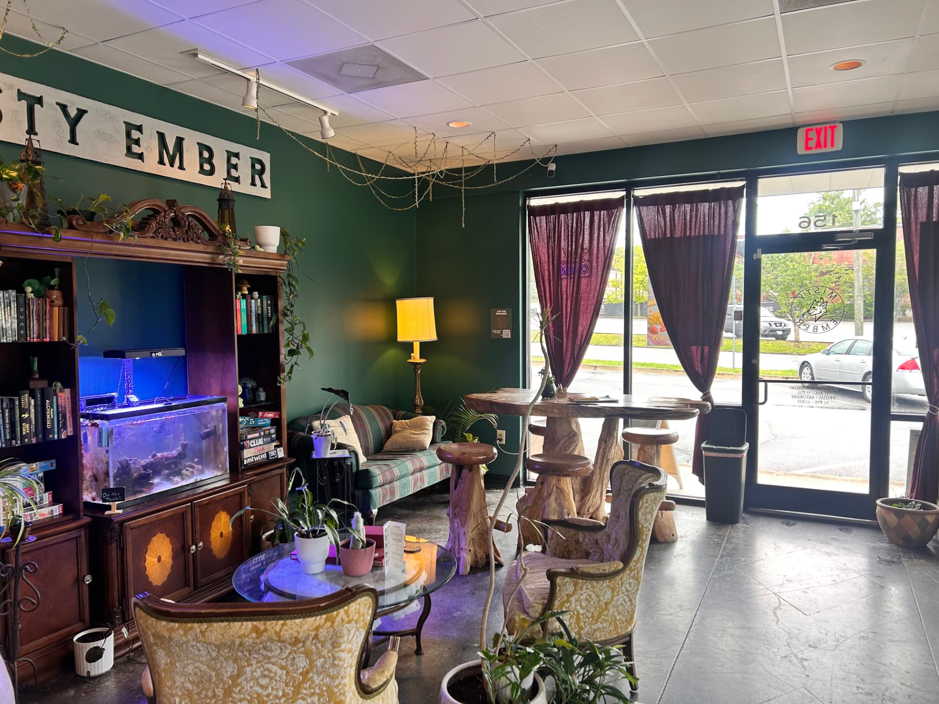Inside Misty Ember Café looking out through the front windows and glass door onto the street